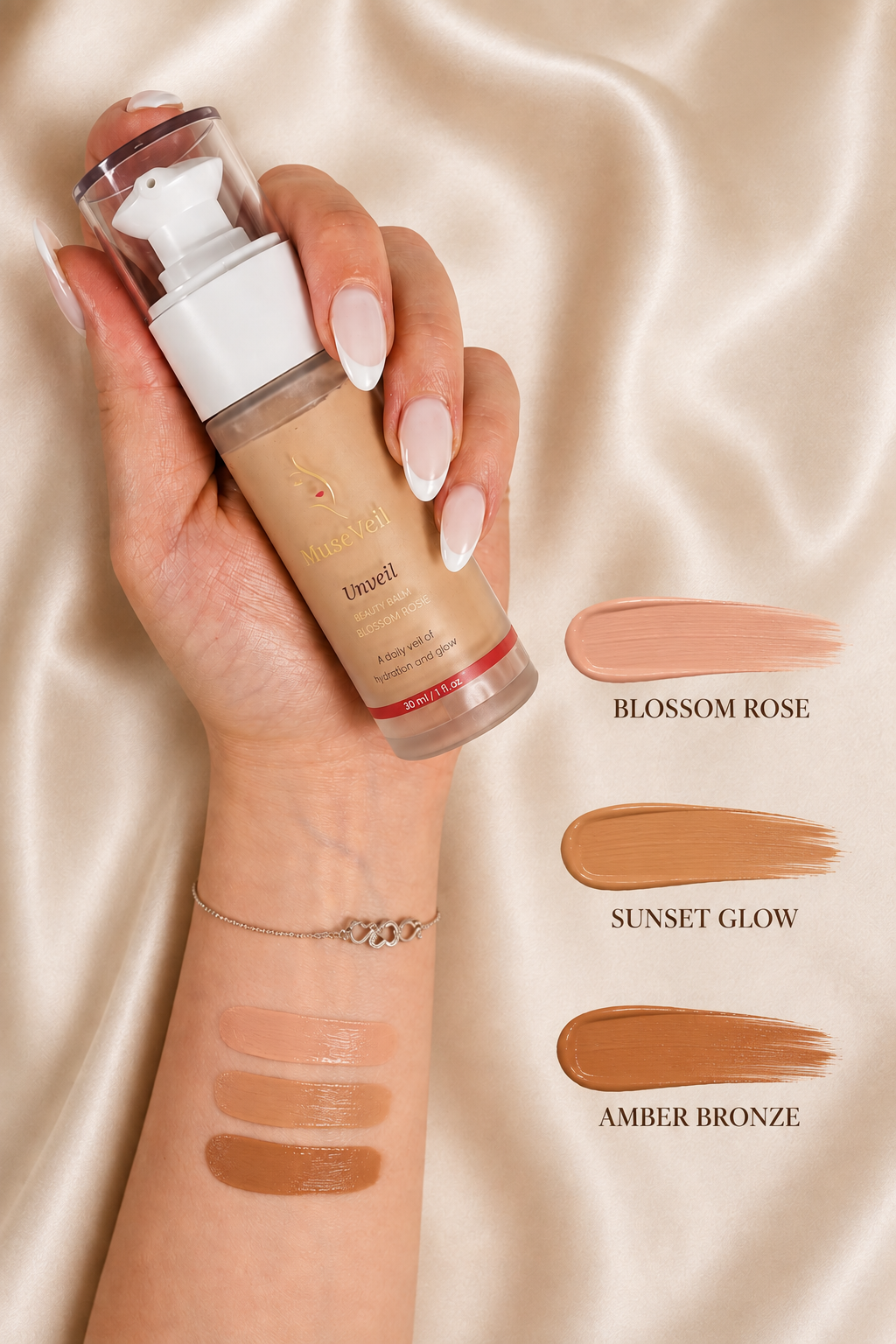 A hand holds a bottle of Elizabeth Taylor New York liquid foundation against a champagne satin background, with three makeup swatches on the wrist labeled Blossom Rose, Sunset Glow, and Amber Bronze.
